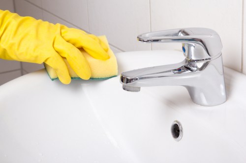 Deep cleaning kitchen surfaces in a Hammersmith home