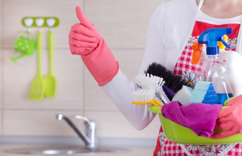 Professional cleaner preparing tools and protective gear before work